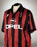 A RED AND BLACK A.C. MILAN SHORT-SLEEVED SHIRT 