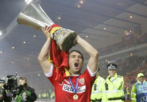 Sevilla's Aleksandr Kerzhakov celebrates with the trophy at the end of the UEFA Cup final in Glasgow.