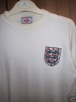 Geniune Alan Ball match worn England home shirt from the successful 1966 World cup campaign. It is a white round collared Umbro no 7 number shirt.