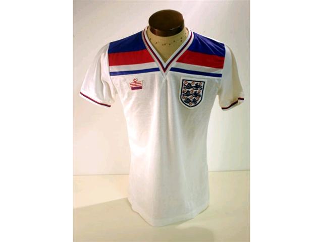 317. England International Shirt: A white with red & blue V-neck shirt with embroidered 3 Lions badge to front, No. 6 to rear also official Itinerary & programme. (3). £250-300