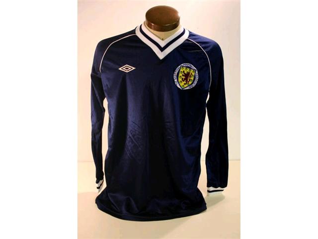 318. Scotland International Shirt: A blue with white trim V-neck shirt with embroidered badge to front, No 16 to rear. £250-300