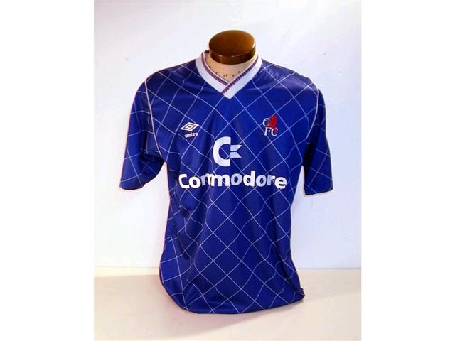440. Players Shirt: A blue with white trim short sleeve Chelsea shirt with embroidered crest & sponsors “Commodore” to front No. 3 to rear. £150-180