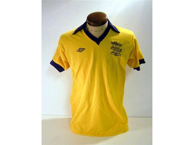 441. Players Shirt: A yellow with blue trim short sleeve Birmingham City shirt c1980 with embroidered crest to front, No. 11 to rear. £100-120.
